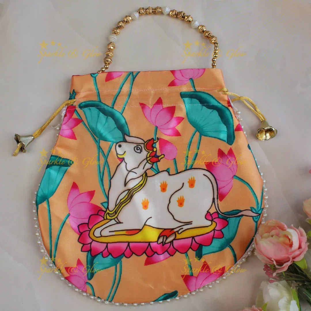 Pretty nandi print potli bags with gold beads - set of 10 - Assorted colours for return gifts - Sparkle and Glow