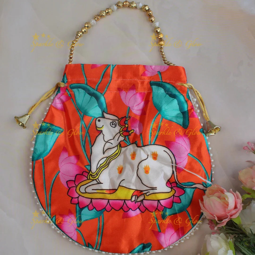 Pretty nandi print potli bags with gold beads - set of 10 - Assorted colours for return gifts - Sparkle and Glow