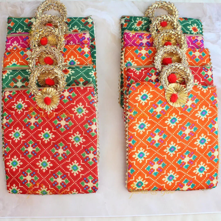 Pretty printed potli bags - set of 10 - Assorted colours for return gifts - Sparkle and Glow