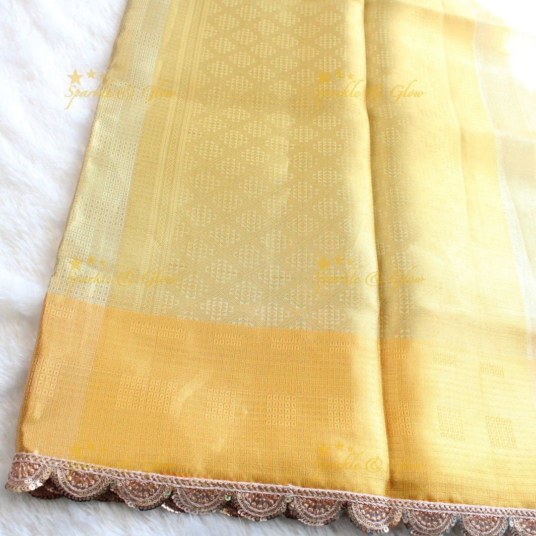 Beautiful light gold colour banarasi tissue silk saree with lace attached with blouse piece