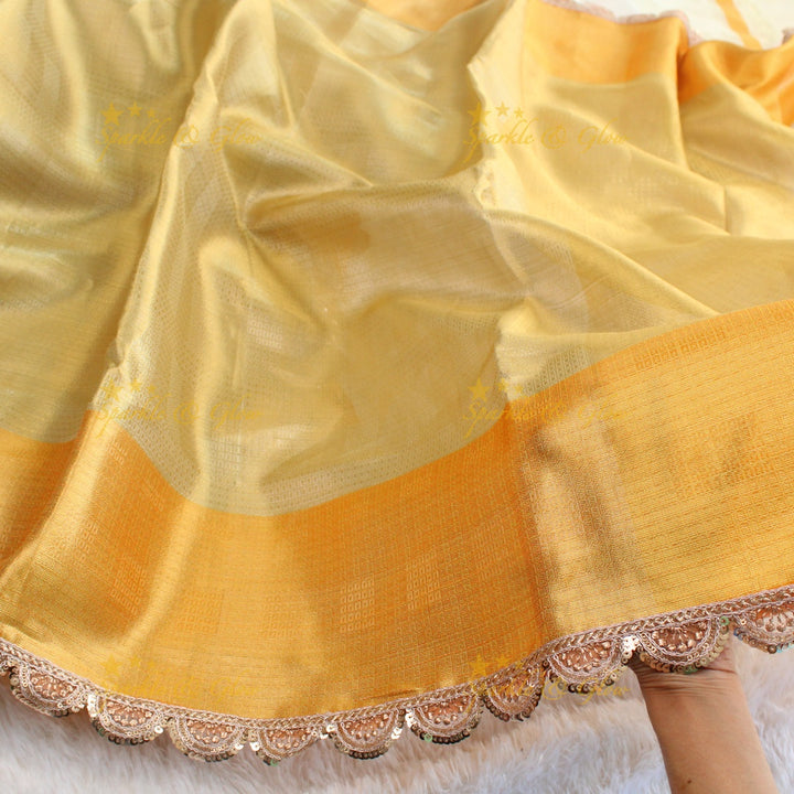 Beautiful light gold colour banarasi tissue silk saree with lace attached with blouse piece