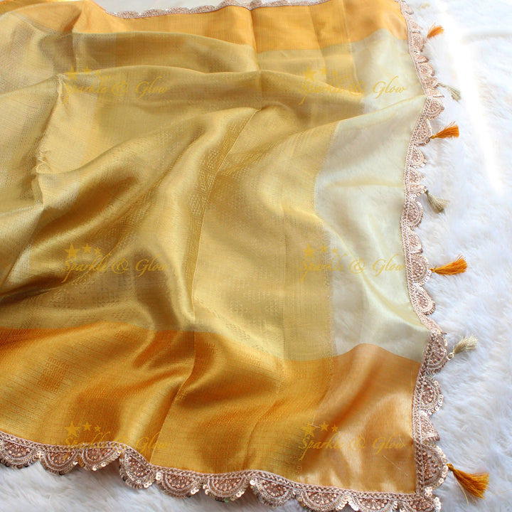 Beautiful light gold colour banarasi tissue silk saree with lace attached with blouse piece
