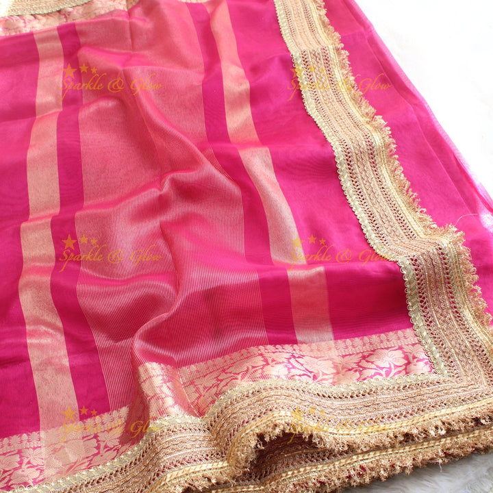 Beautiful pink colour banarasi tissue silk saree with lace attached with blouse piece