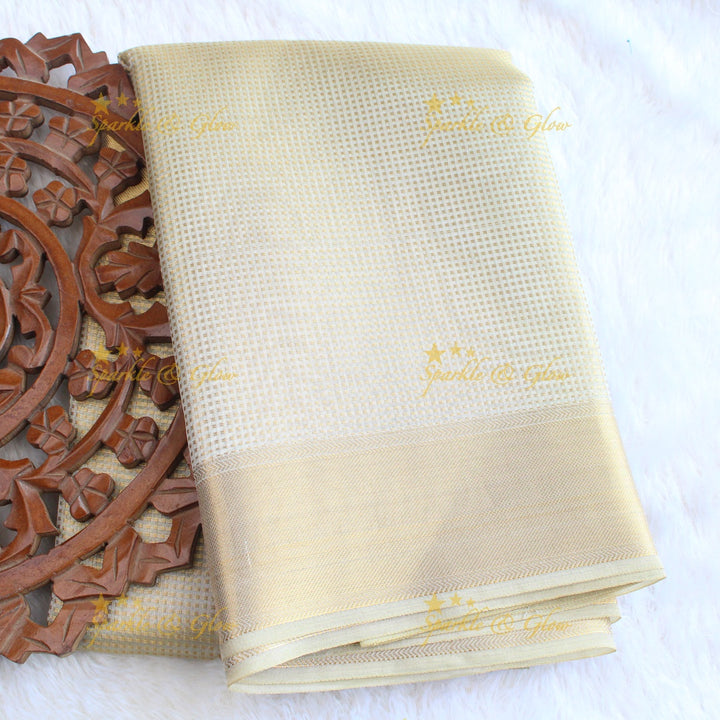 Nayanthara inspired Simple and elegant cream colour banarasi tissue silk saree with blouse piece