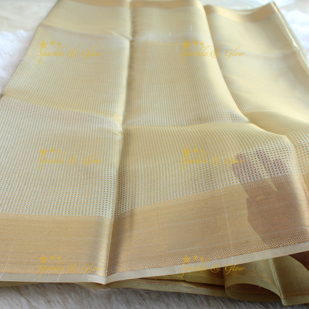 Nayanthara inspired Simple and elegant cream colour banarasi tissue silk saree with blouse piece