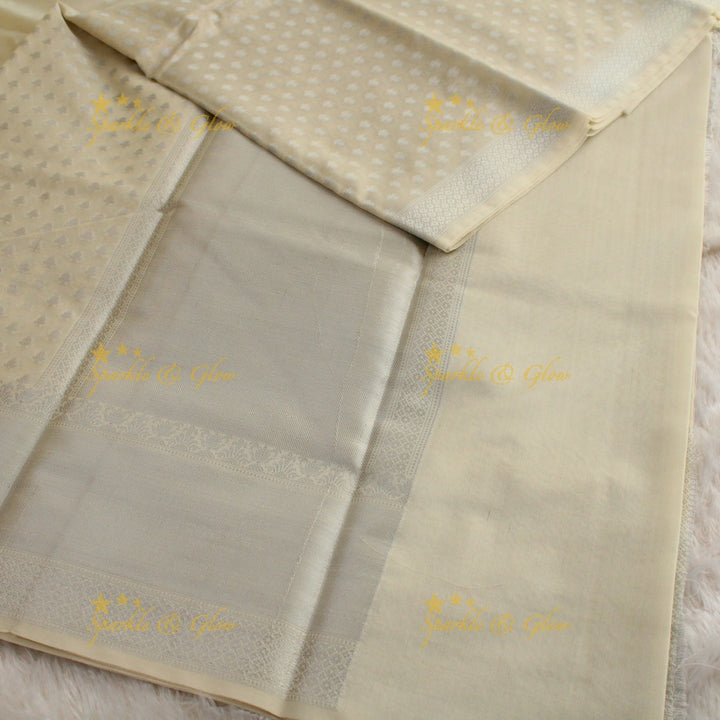 Simple cream colour banarasi tissue silk saree with blouse piece