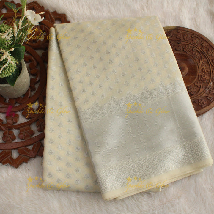Simple cream colour banarasi tissue silk saree with blouse piece