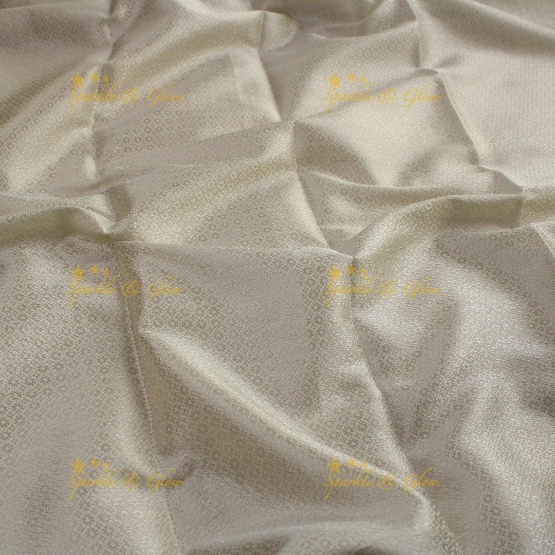 Simple cream colour banarasi tissue silk saree with blouse piece