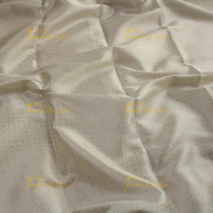 Simple cream colour banarasi tissue silk saree with blouse piece