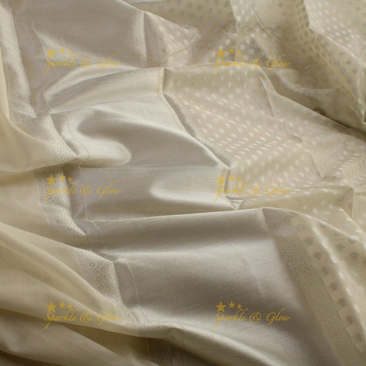 Simple cream colour banarasi tissue silk saree with blouse piece