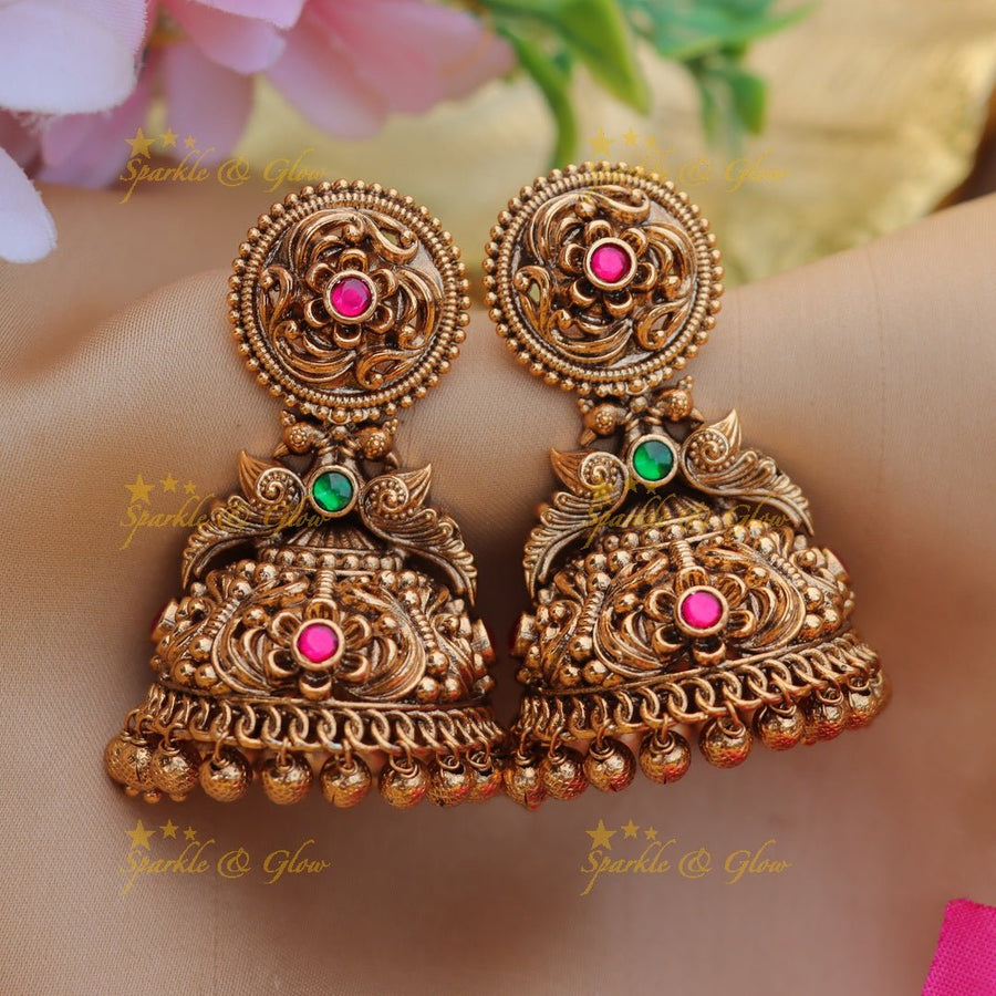 Pretty floral and peacock design gold jhumukas with mint green beads - Sparkle and Glow - 