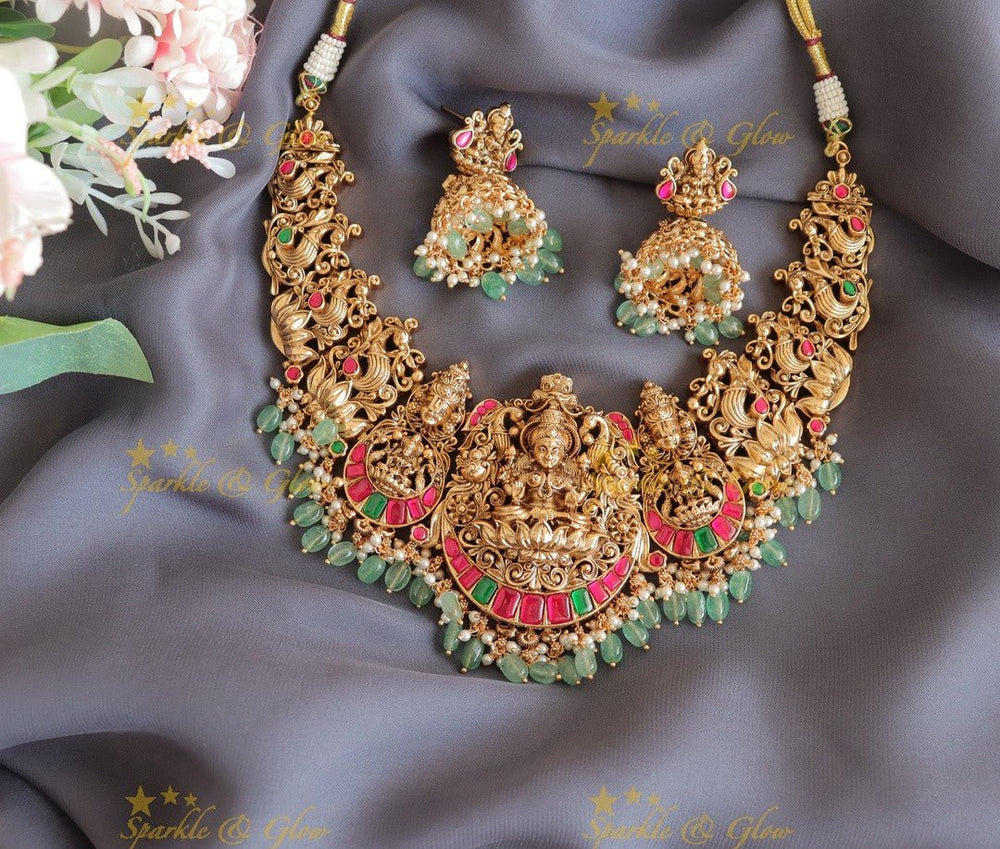 Stunning Idol Lakshmi Peacock carved Jadau short necklace with gold beads - Sparkle and Glow - Mintgreen - 