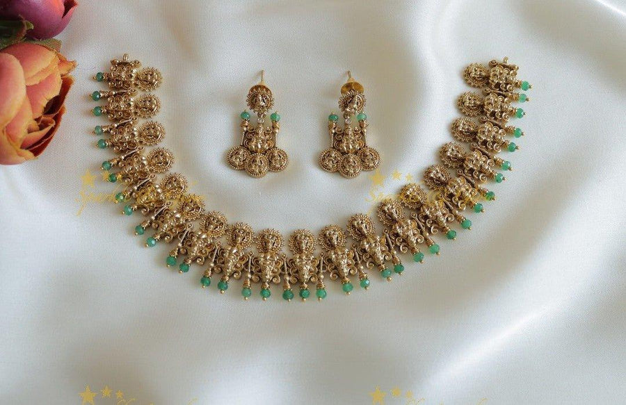 Intricately carved Idol Lakshmi coin design short necklace - Sparkle and Glow