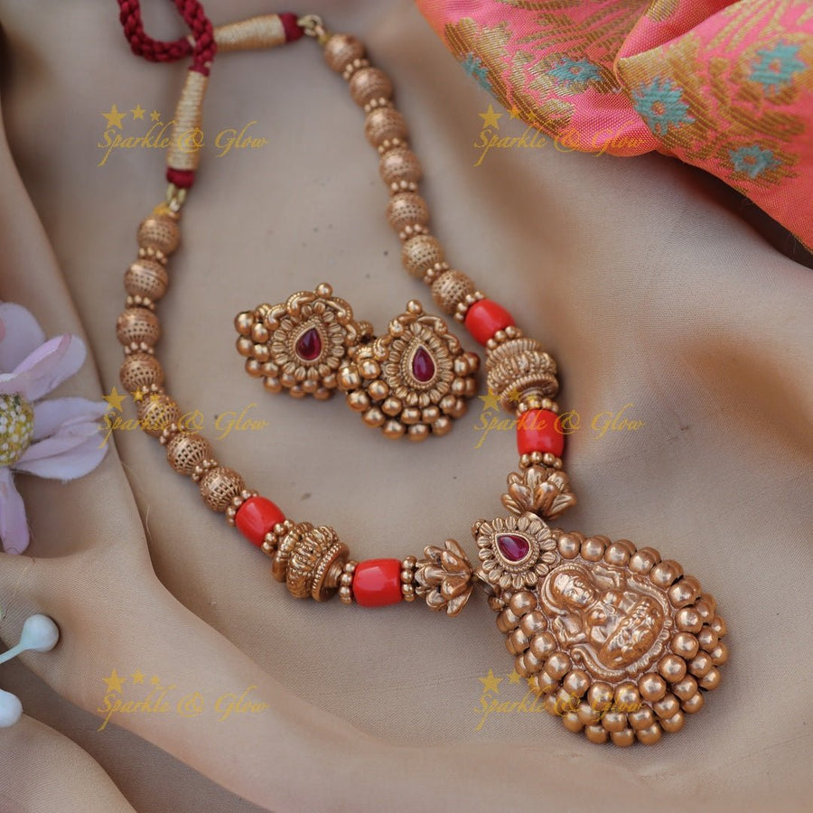 Stunning Idol Lakshmi pendant carved Coral short necklace - Sparkle and Glow - 