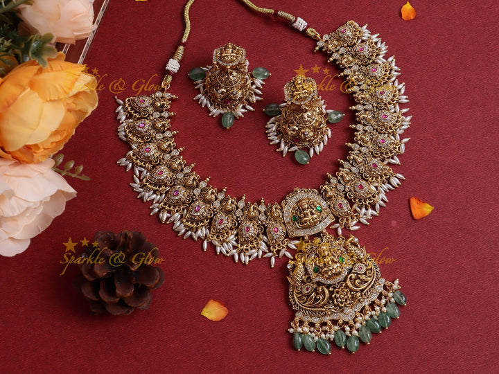 Elegant Idol Lakshmi Peacock Mango carved rice pearl guttapusalu short necklace with cz stones