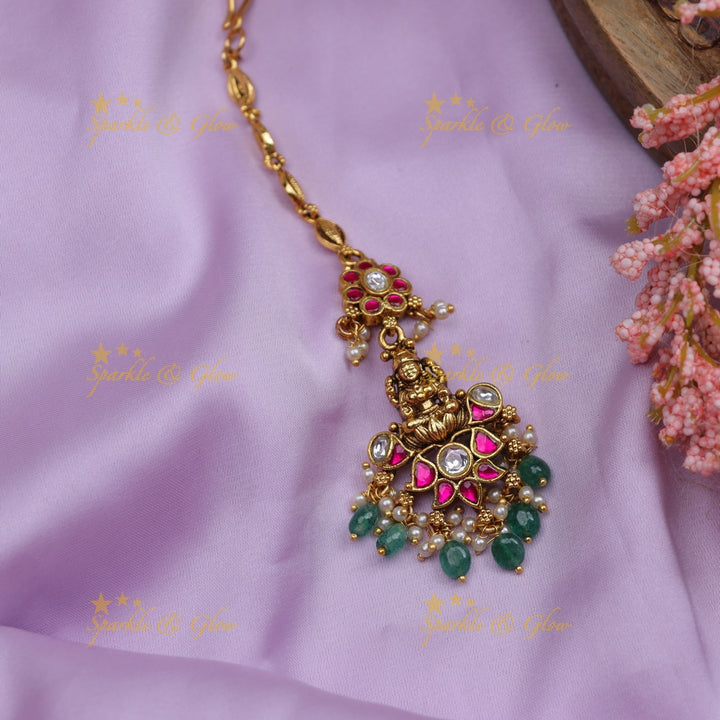 Stunning Jadau Temple Maang Tikka with Lakshmi Pendant, Kundan & Emerald Beads