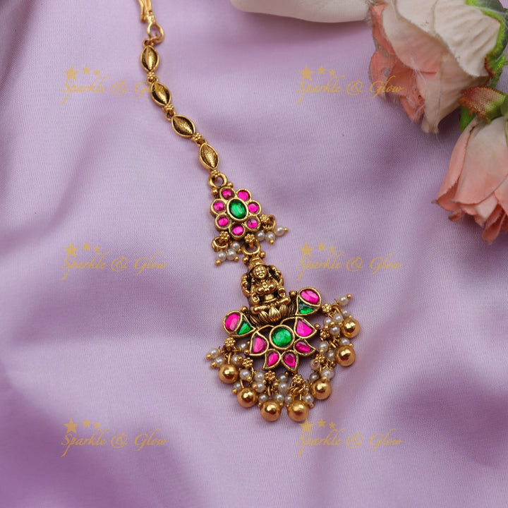 Stunning Jadau Temple Maang Tikka with Lakshmi Pendant, Kundan & Emerald Beads