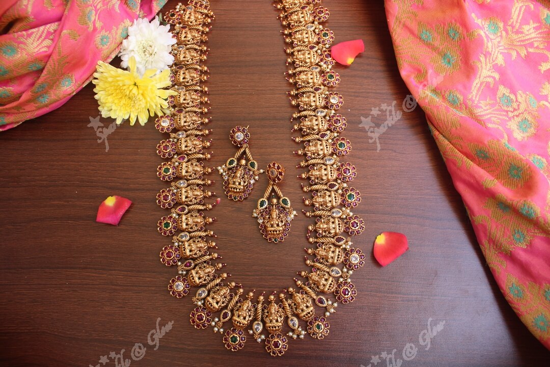 Gold alike polished lakshmi long necklace with flower studs made in real kemp stones