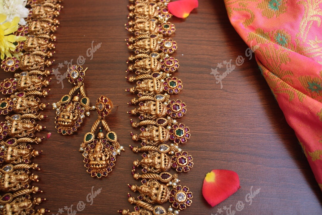 Gold alike polished lakshmi long necklace with flower studs made in real kemp stones