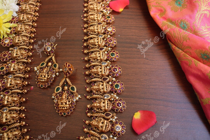 Gold alike polished lakshmi long necklace with flower studs made in real kemp stones