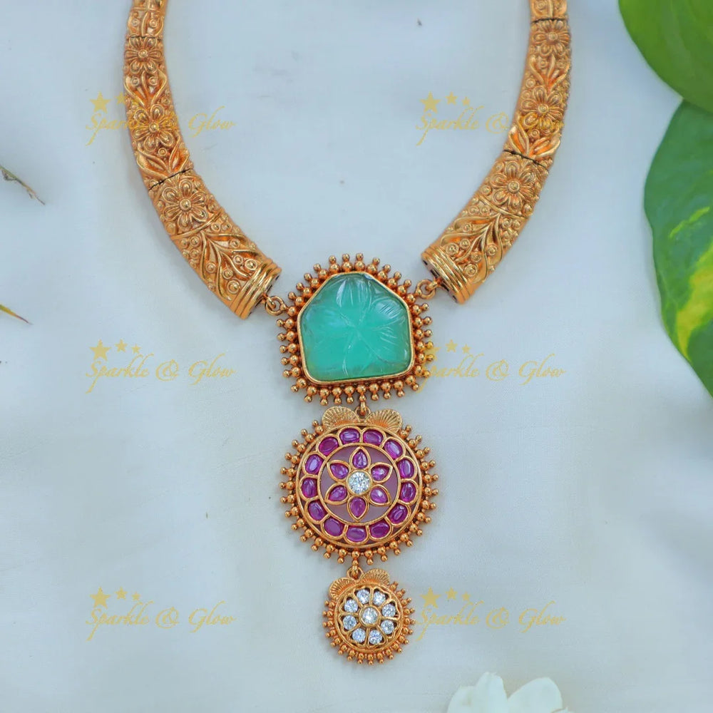 Beautiful Antique Gold alike Hasli Kanti Necklace Set with Green Stone & Floral Motif Pendants - Sparkle and Glow