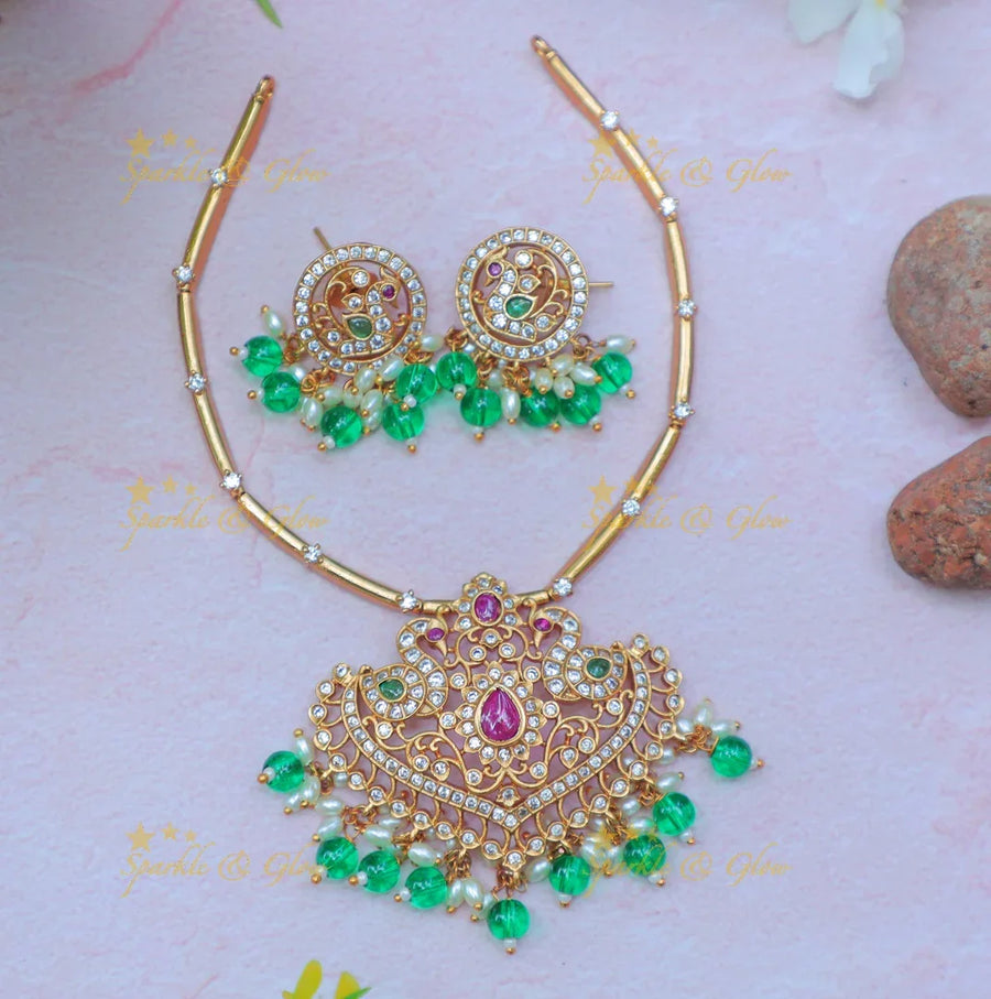 Stunning Gold alike Hasli Kanti Necklace Set with Green Beads & Stone Studded Pendant - Sparkle and Glow