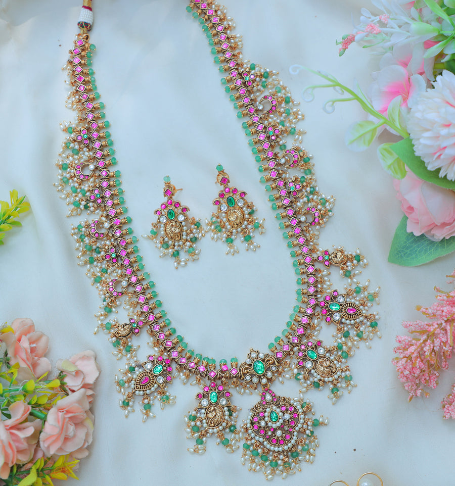 Gracious Jadau Kundan Antique Gold alike Lakshmi Necklace Set with Pink & Green Stone Embellishments - Sparkle and Glow