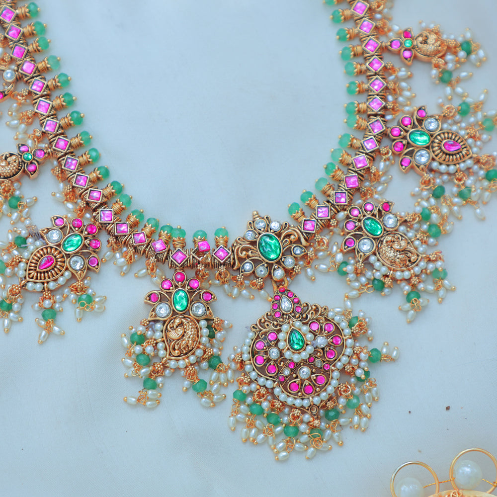 Gracious Jadau Kundan Antique Gold alike Lakshmi Necklace Set with Pink & Green Stone Embellishments - Sparkle and Glow