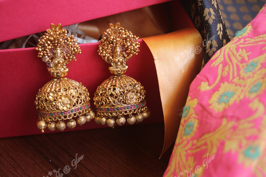 Gold cluster lakshmi studded intricate gold alike jhumukas