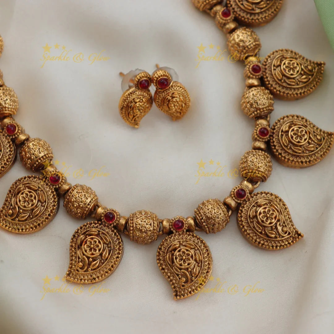 Budgeted Mango Floral Carved Gold Finish Short Necklace