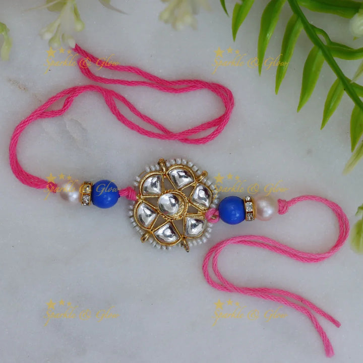 Exquisite Kundan Rakhi with Floral Design & Red Thread