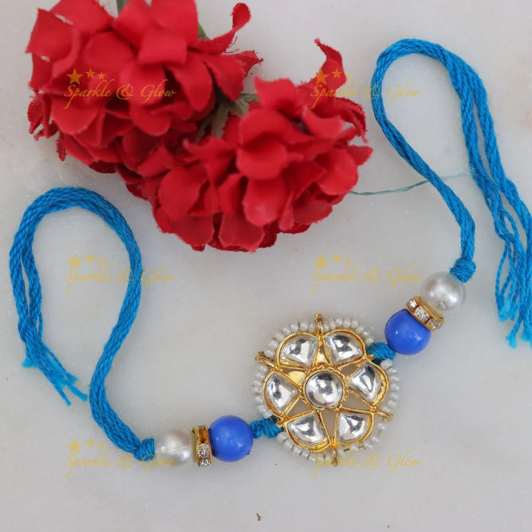 Exquisite Kundan Rakhi with Floral Design & Red Thread