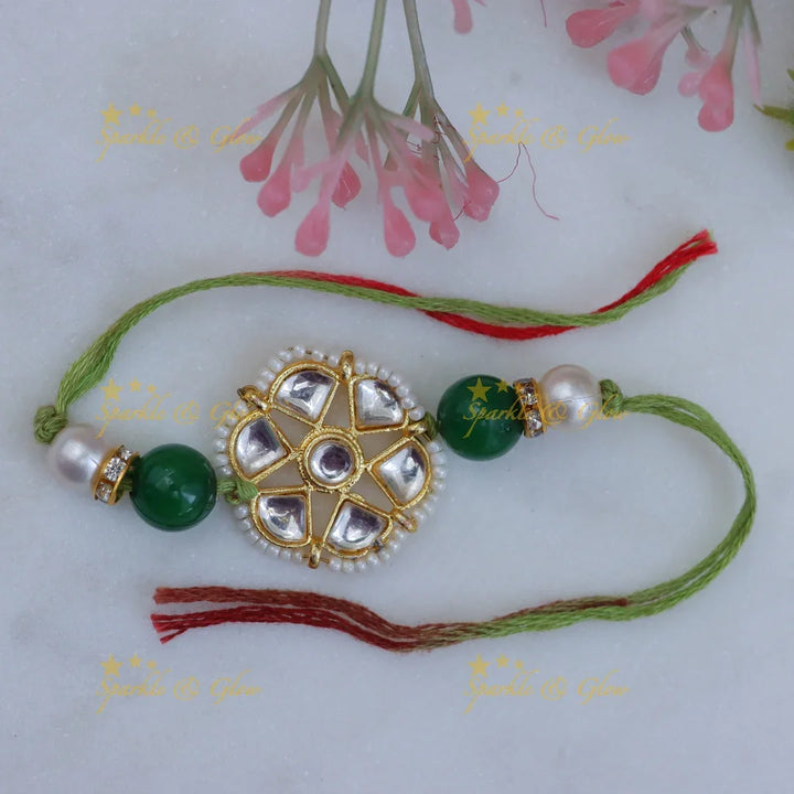 Exquisite Kundan Rakhi with Floral Design & Red Thread