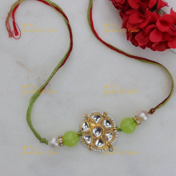 Exquisite Kundan Rakhi with Floral Design & Red Thread