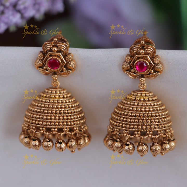 Exquisite Gold Jhumka Earrings with Glorious Green Stones