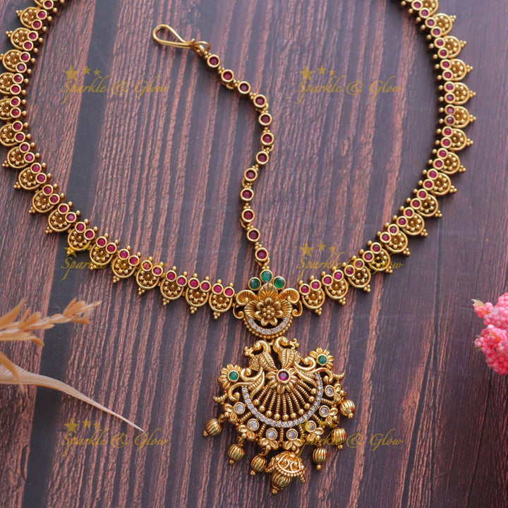 Mesmerizing Peacock Maang Tikka with Kemp Flowers