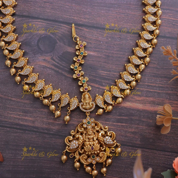 Elegant Lakshmi Peacock Maang Tikka - Sparkle & Glow