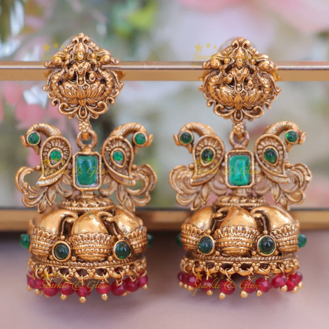 Lakshmi Floral Jhumka Earrings with Rubies in Antique Gold