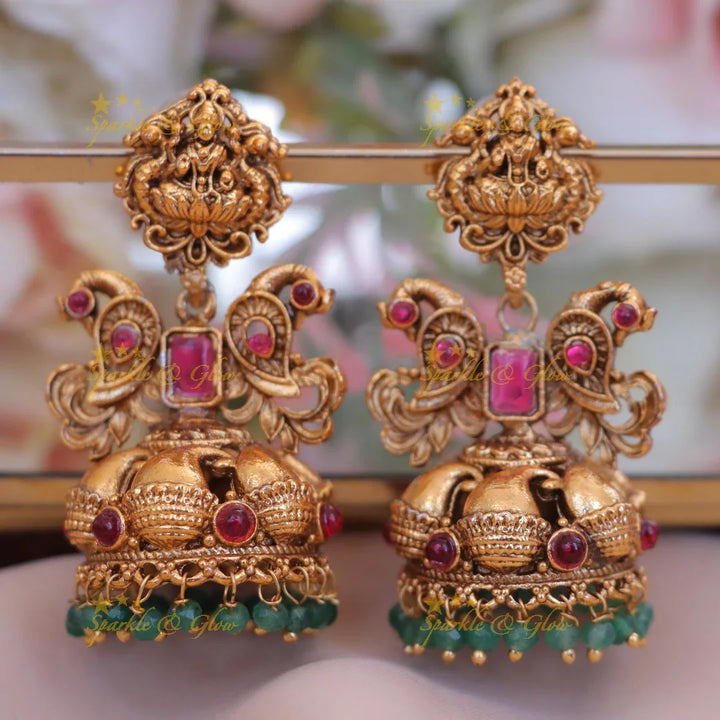 Lakshmi Floral Jhumka Earrings with Rubies in Antique Gold