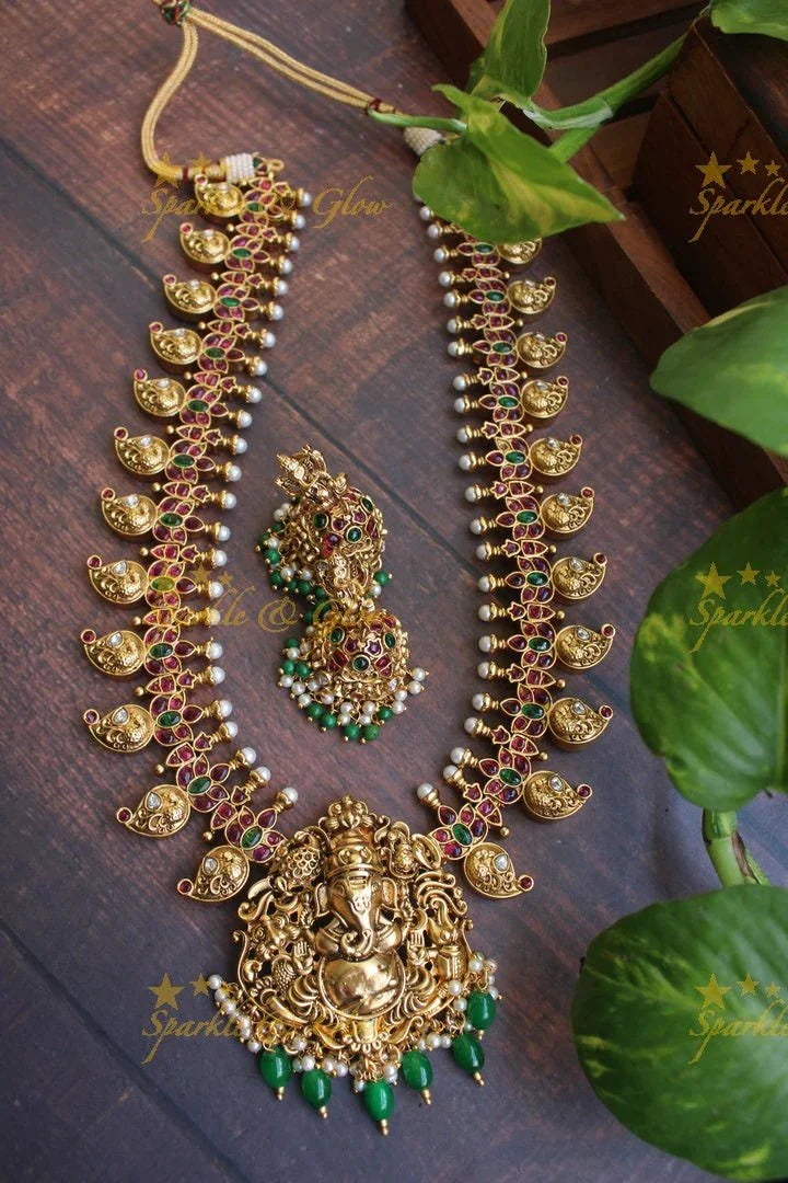 Gold alike Ganesha carved mango haram - Sparkle and Glow