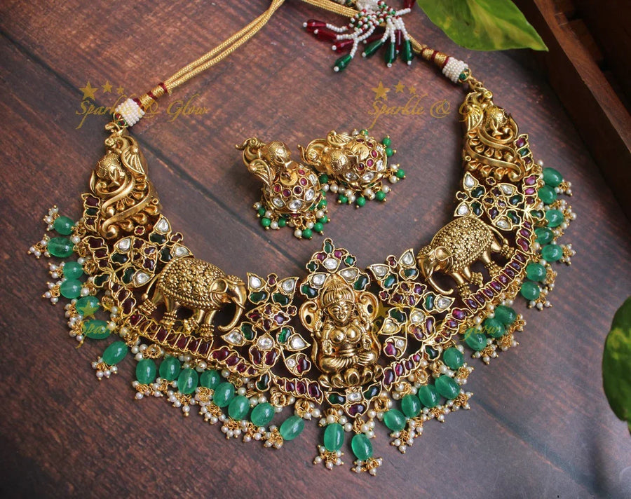 Exclusive silver replica Lakshmi intricate carved necklace in gold alike polish - Green Beads - Sparkle and Glow