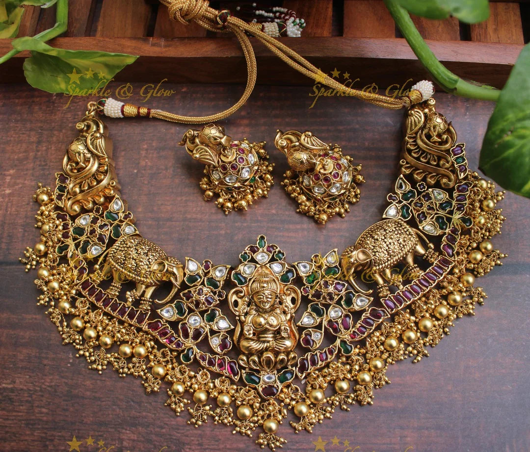Exclusive silver replica Lakshmi intricate carved necklace in gold alike polish - Green Beads - Sparkle and Glow