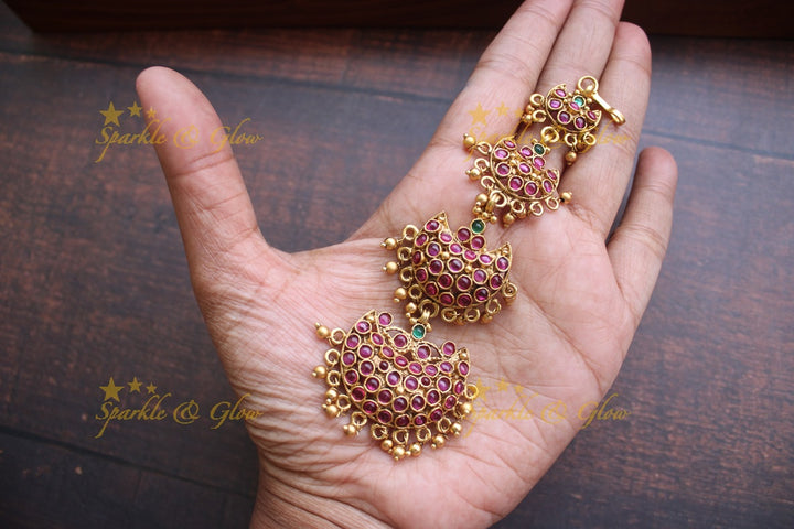 Gold alike polished half moon design maangthika with kemp stones