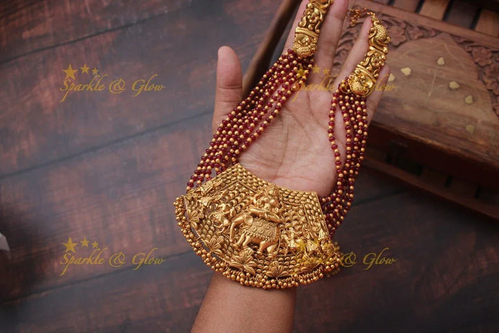 Gold alike intricate Lakshmi Bead necklace - Ruby - Sparkle and Glow