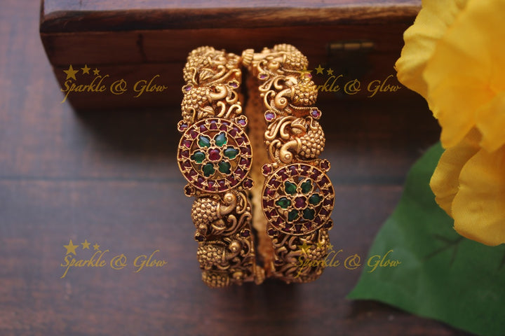 Gold alike intricate peacock bangles a pair