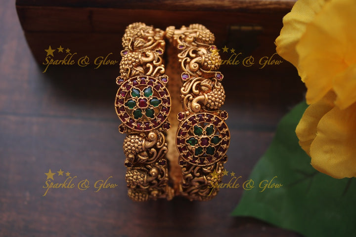 Gold alike intricate peacock bangles a pair