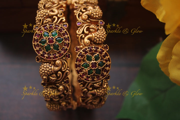 Gold alike intricate peacock bangles a pair