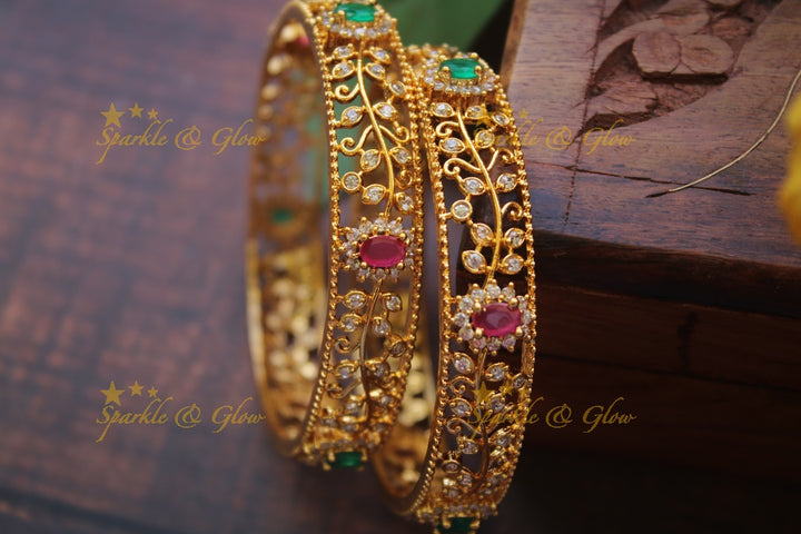 Gold alike AD stone bangles a pair