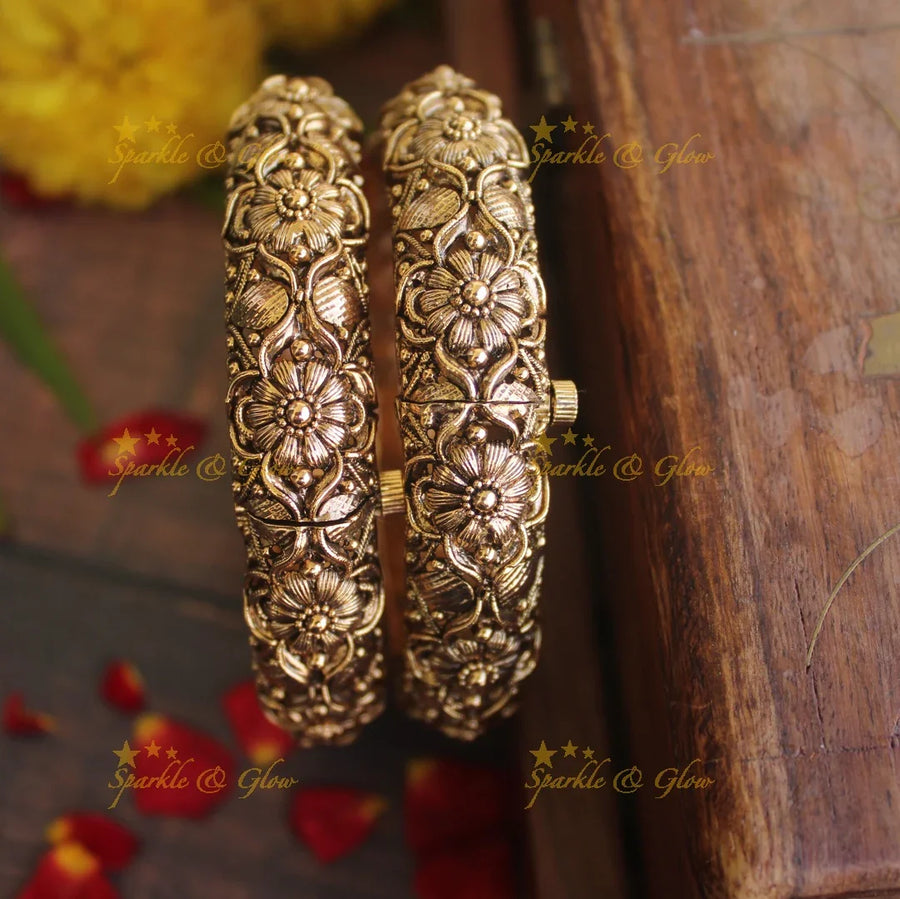 Gold alike antique floral intricate carved kada type screw bangles - Sparkle and Glow