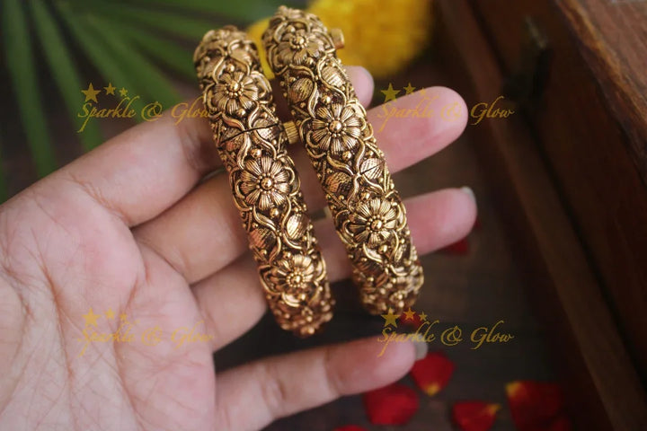 Gold alike antique floral intricate carved kada type screw bangles - Sparkle and Glow
